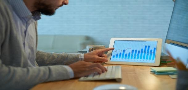 man looking at a chart