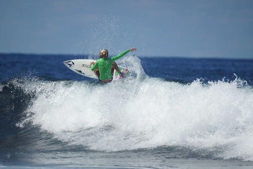 Surfer riding a wave in the ocean